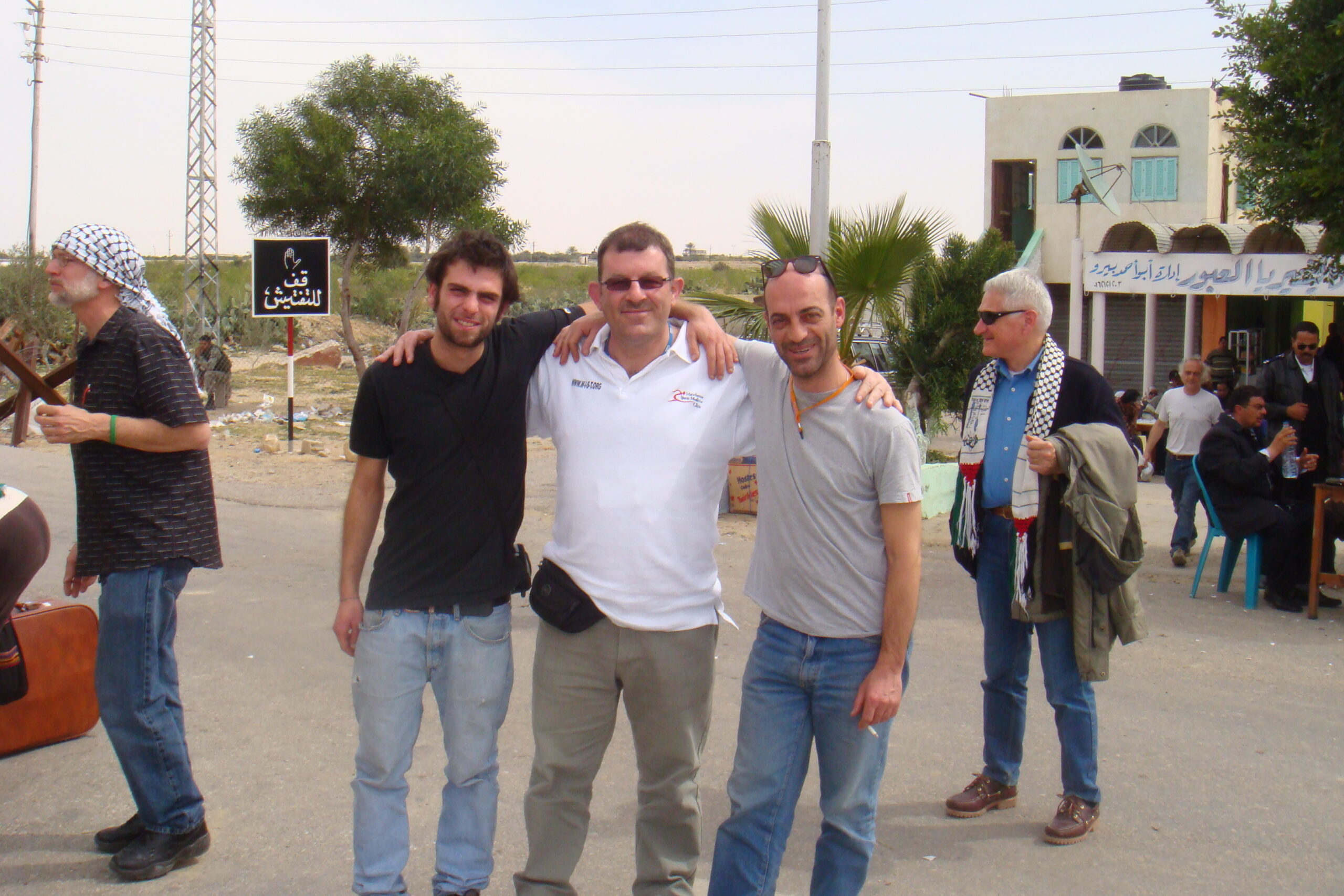 a group of three healthcare worker standing togather at the Rafah border in Gaza March 2009